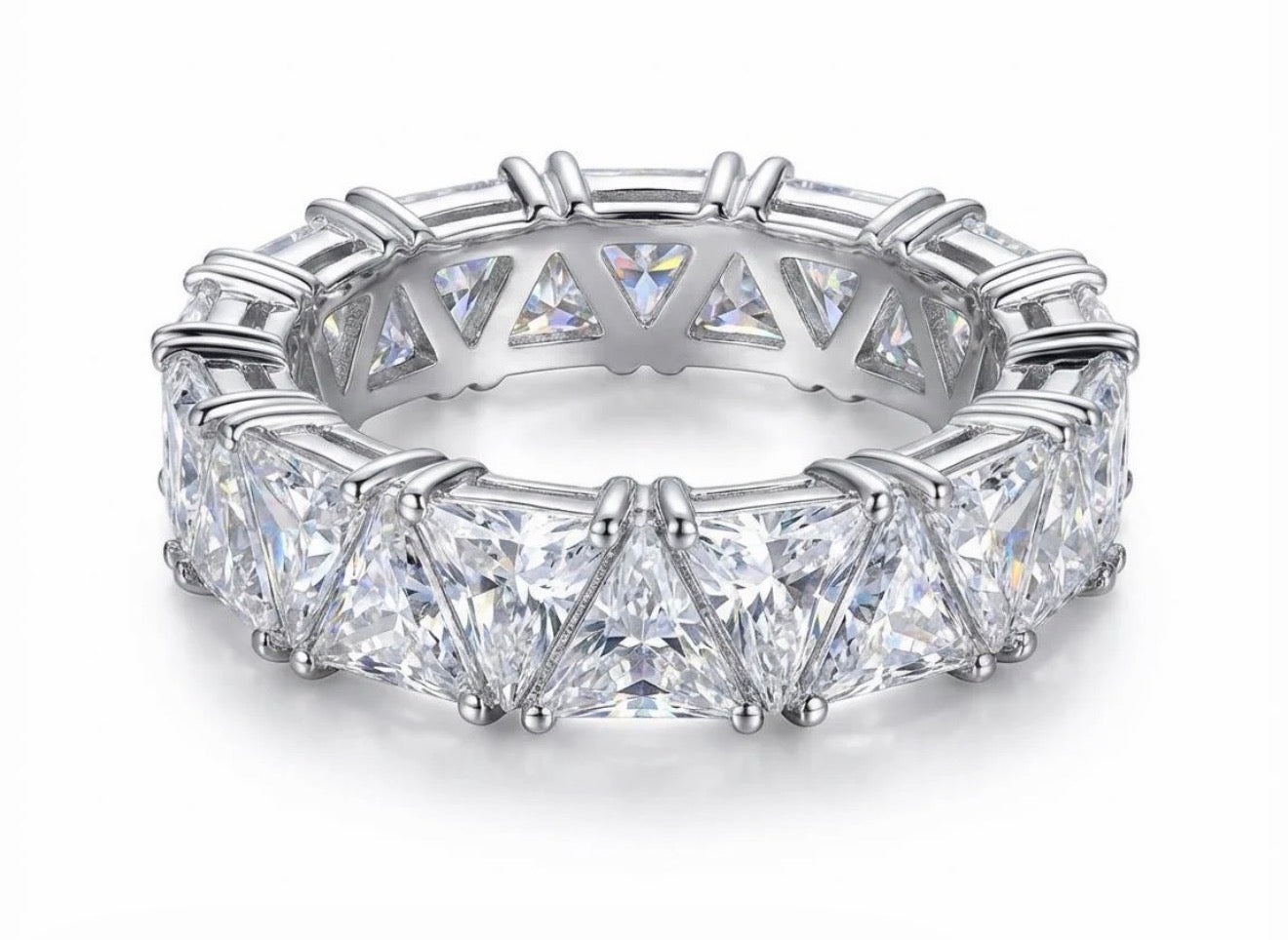 Closeup of the Maya Ring, a silver-tone eternity ring with sparkling triangular-cut clear stones.