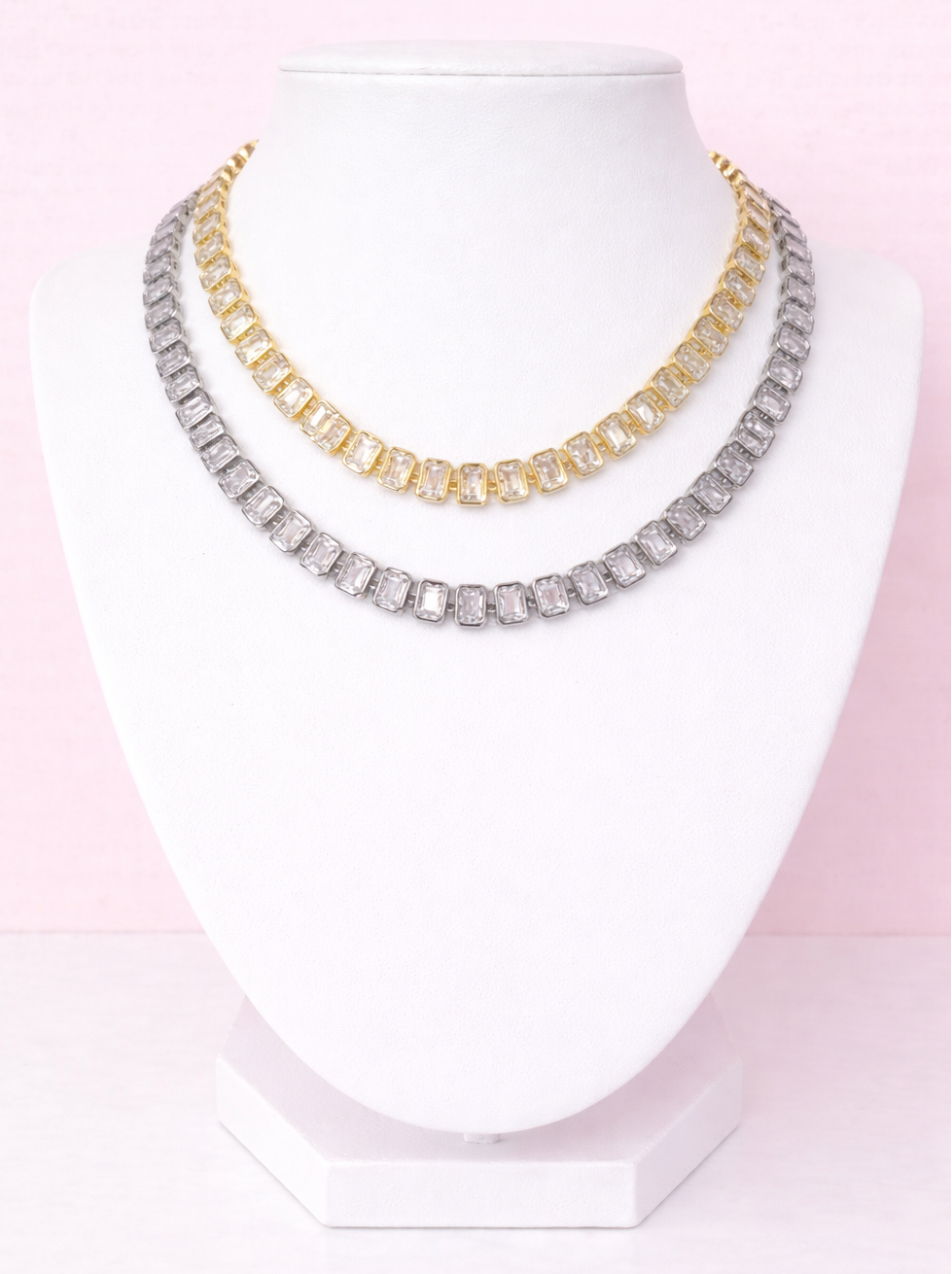 Two tennis necklaces, one gold and one silver