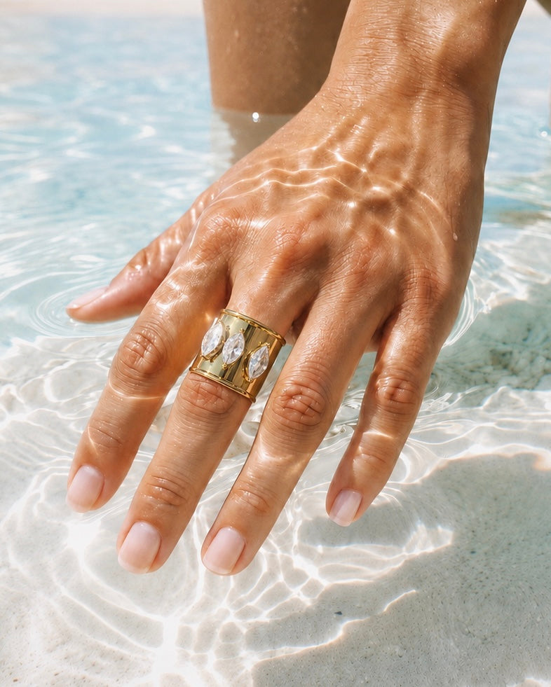 Bali Ring, an adjustable 18k gold-plated stainless steel statement ring with three marquise-cut cubic zirconia stones.