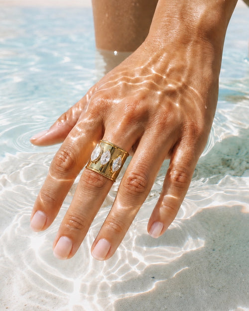 Bali Ring, an adjustable 18k gold-plated stainless steel statement ring with three marquise-cut cubic zirconia stones.