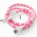 Colorful beaded charging cable with USB connector and 2-in-1 Type-C and Lightning ends on white background