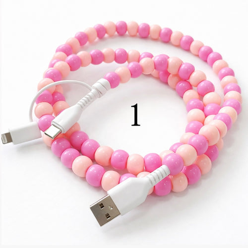 Colorful beaded charging cable with USB connector and 2-in-1 Type-C and Lightning ends on white background