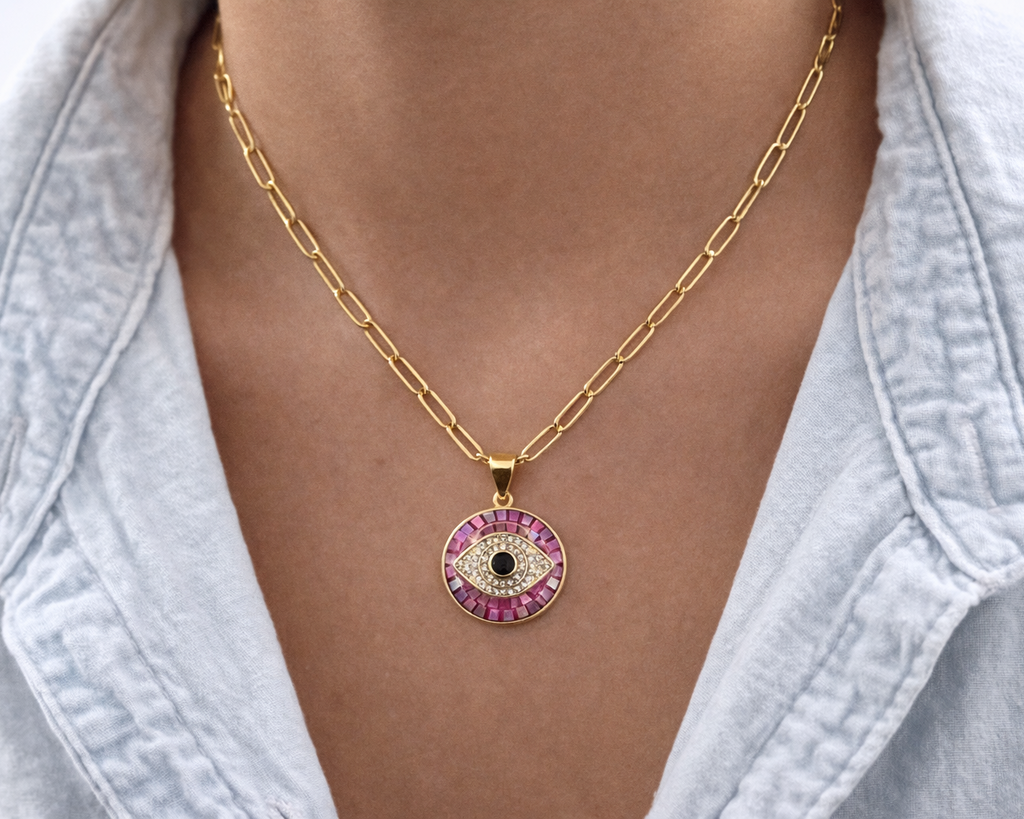 Gold pink evil eye pendant on model