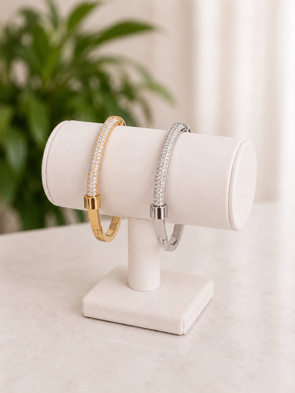 Gold and silver stainless steel crystal pavé bangle bracelets with a slim polished band.