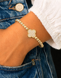 14k Gold plated beaded stretch bracelet with a clover-shaped charm