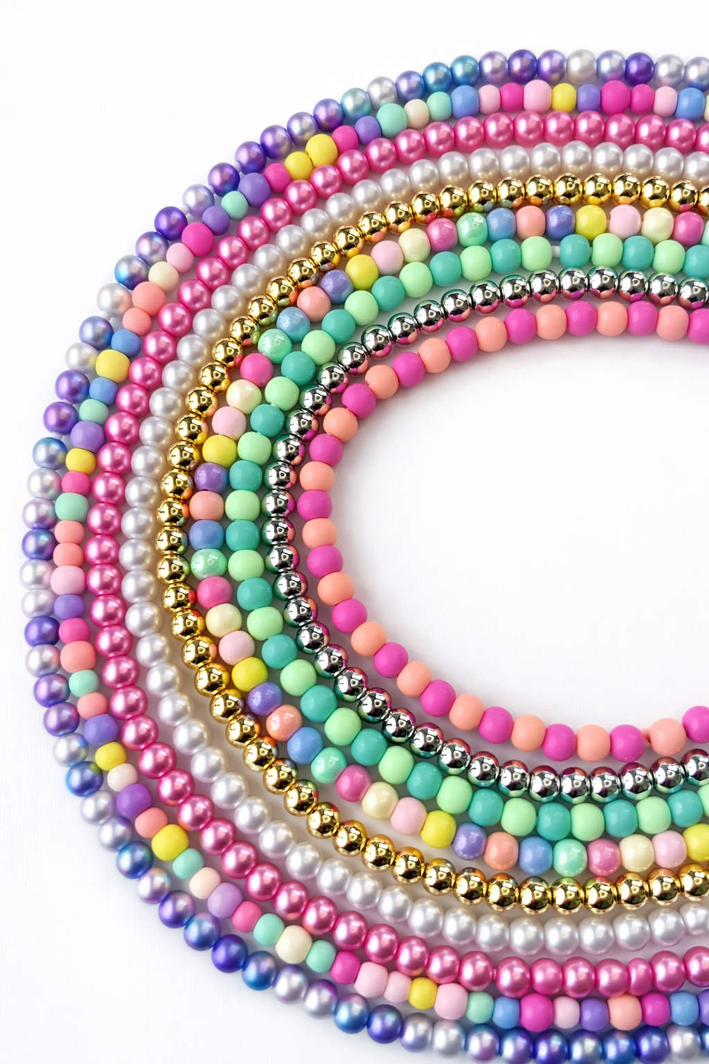 Colorful beaded charging cable with USB connector and 2-in-1 Type-C and Lightning ends on white background