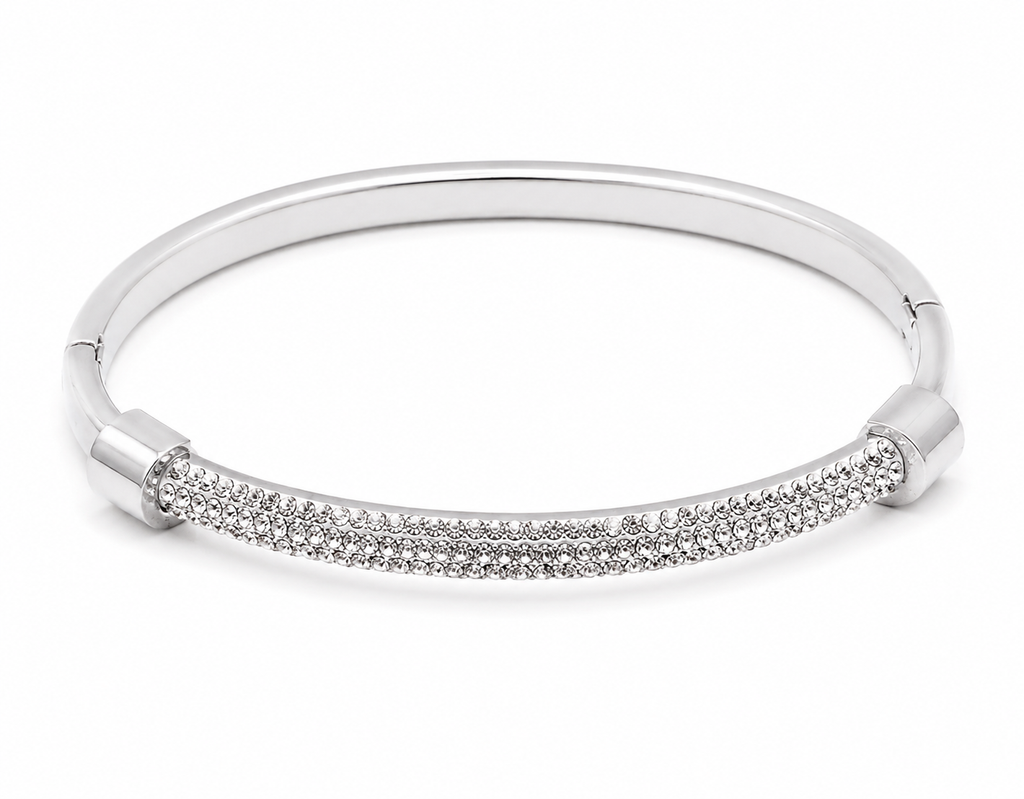 Silver stainless steel crystal pavé bangle bracelet with a slim polished band.