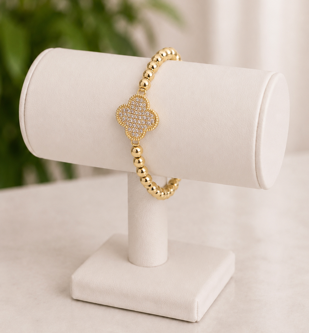 14k Gold plated beaded stretch bracelet with a clover-shaped charm
