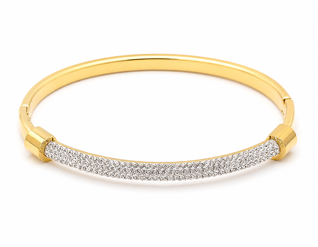 Gold stainless steel crystal pavé bangle bracelet with a slim polished band.