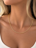 Model wearing a 2mm 14k gold-plated 925 sterling silver chain necklace with a minimalist everyday look.