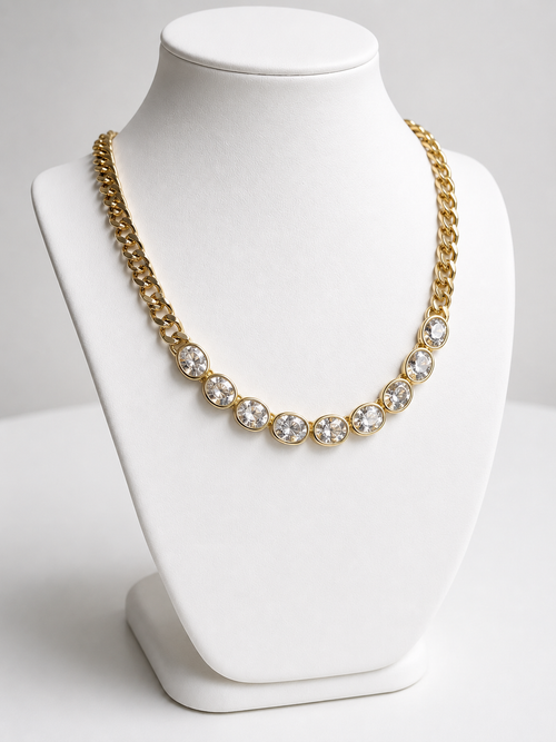 Dakota Necklace in 14k gold plating featuring oval cubic zirconia stones on a chunky cable link chain shown on display