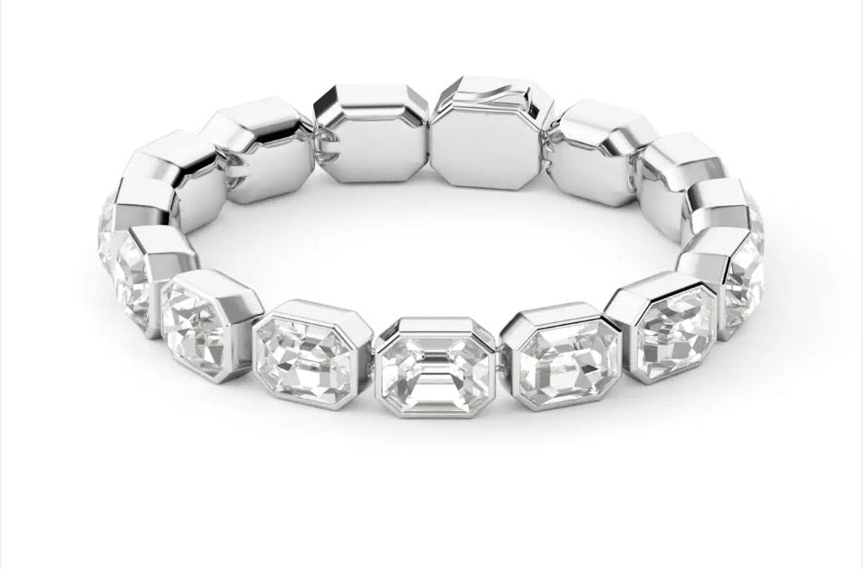 Close-up of silver bracelet with clear rectangular crystals catching light