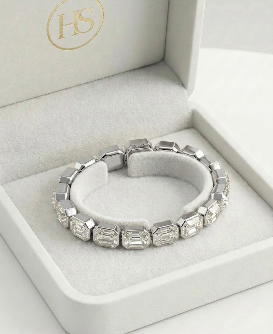 Close-up of silver bracelet with clear rectangular crystals catching light