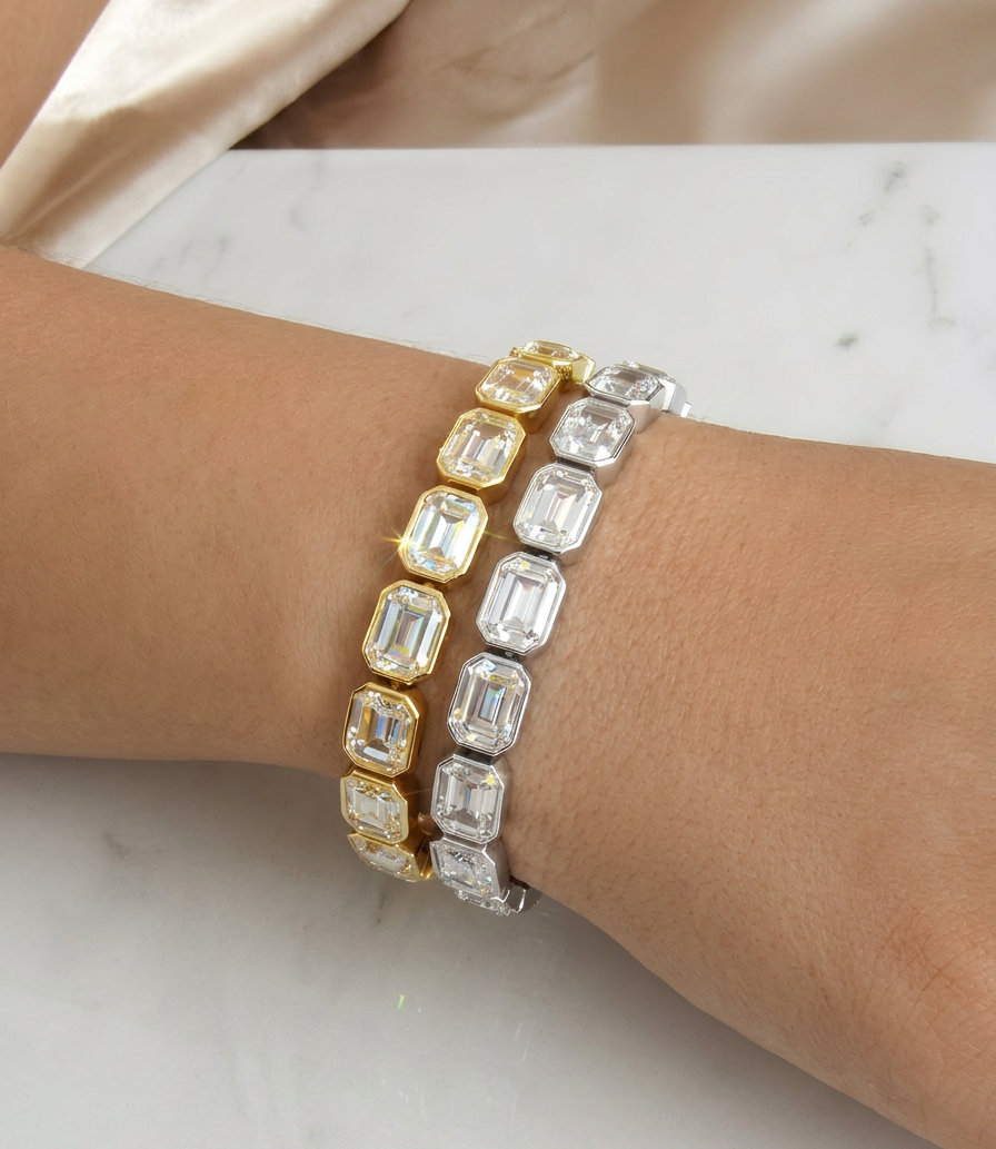 Gold crystal tennis bracelet on wrist with rectangular-cut stones, elegant everyday jewellery