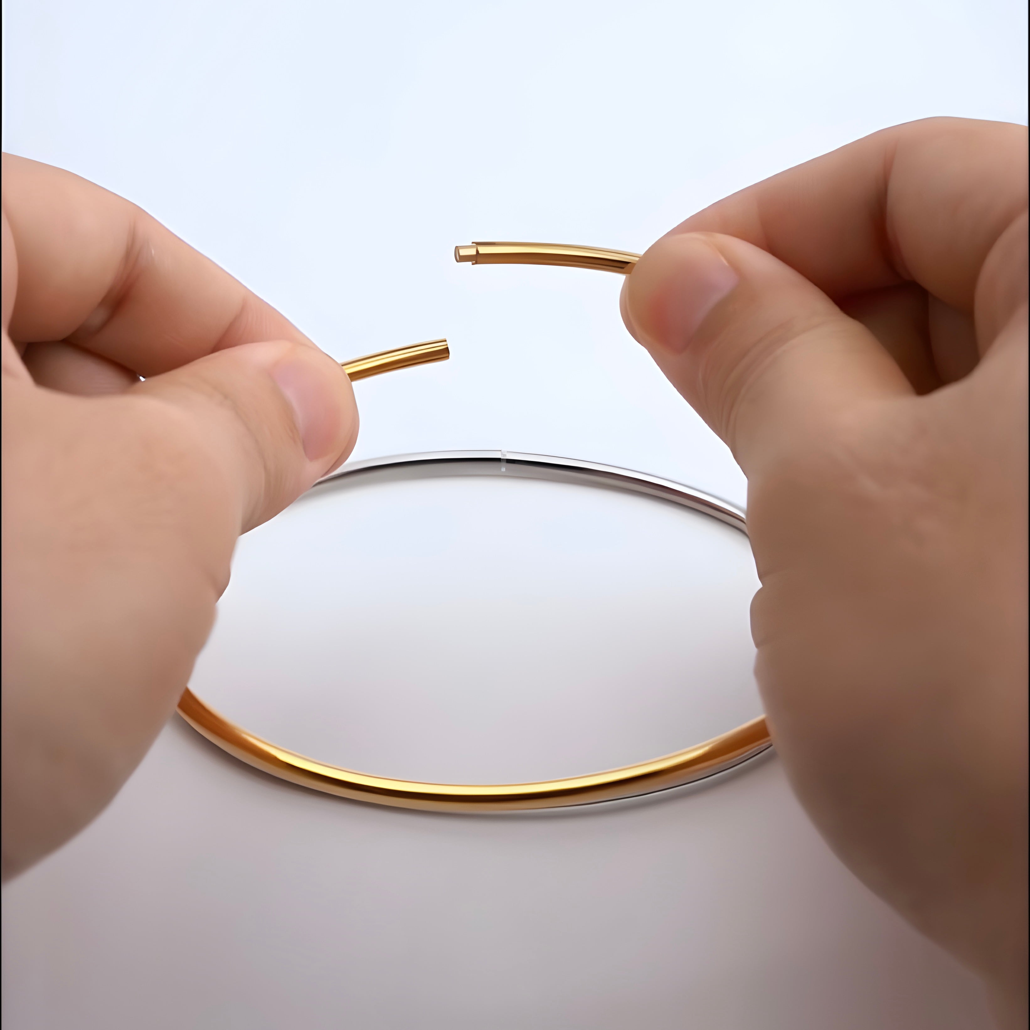 Lightweight gold plated oval shown how to open