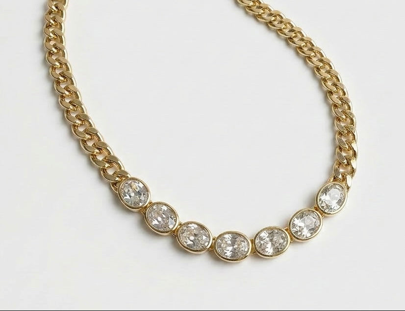 Dakota Necklace in 14k gold plating featuring oval cubic zirconia stones on a chunky cable link chain shown up close