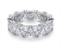 Silver eternity style ring with triangular cut clear stones set around the band
