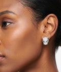 Model wearing silver leopard head stud earrings