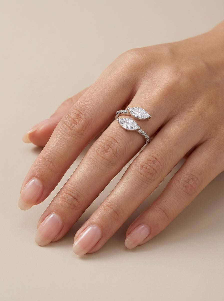 Sterling silver adjustable ring with marquise cut stones worn on hand