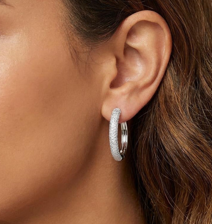 Model wearing small sterling silver, pavé hoop earrings