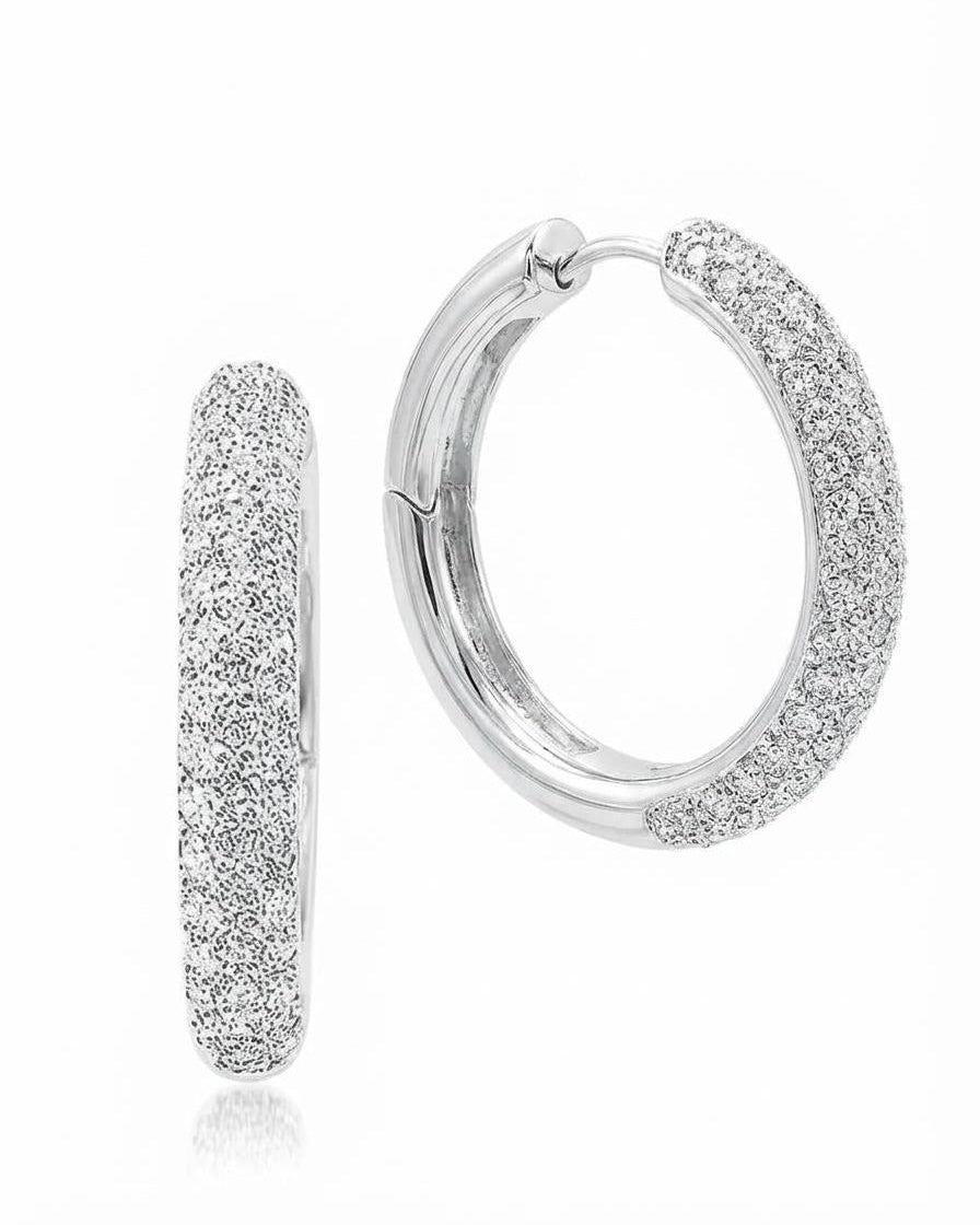 Close up of sterling, silver pavé hoop earring with hinged clasp