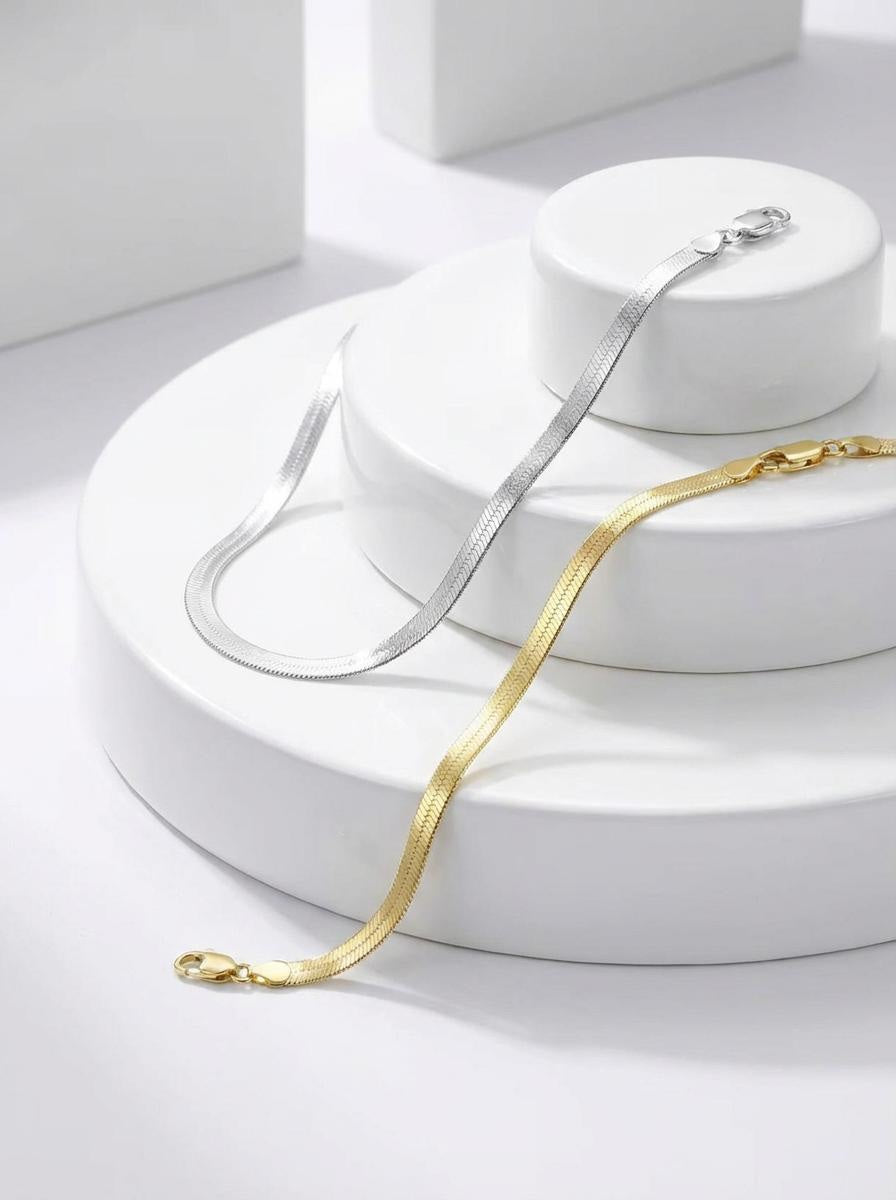 Gold and silver Mini Andi bracelet styled on a neutral display