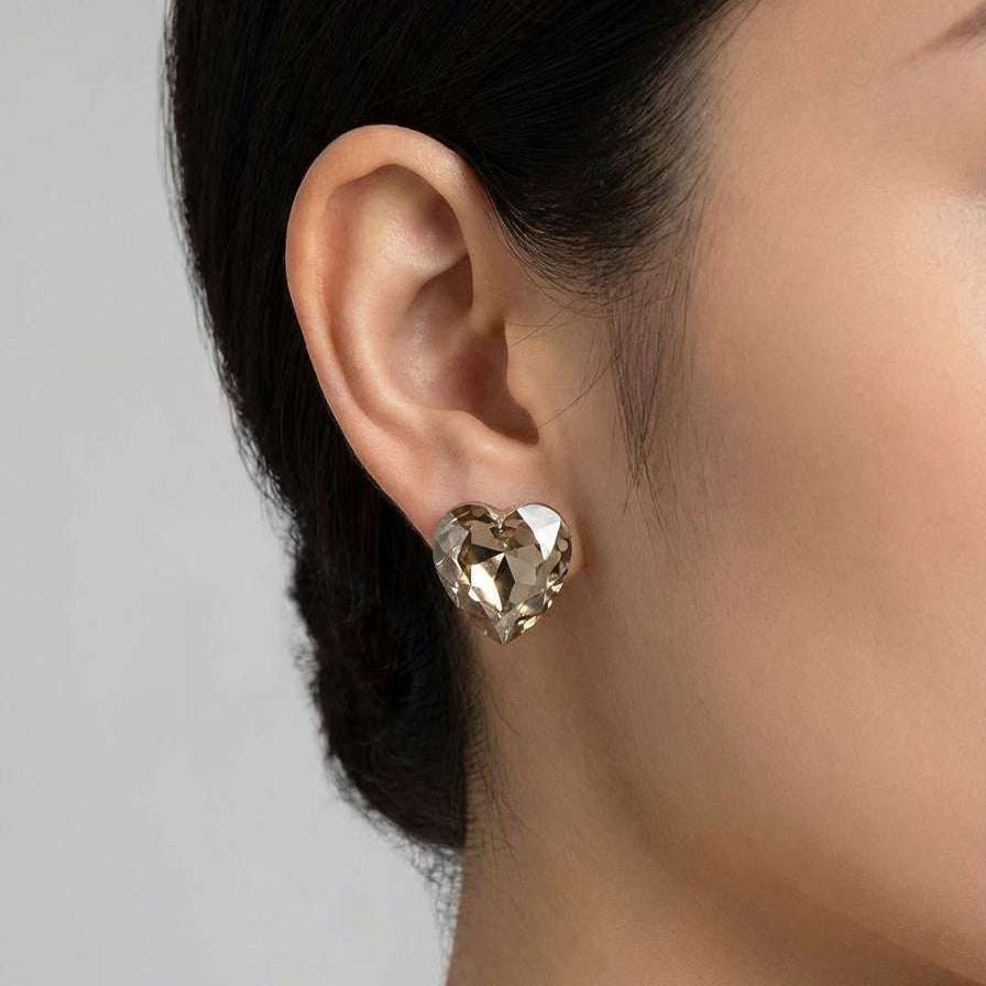 Crystal heart stud earring worn model.