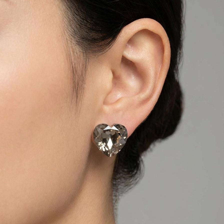 Crystal heart stud earring on model