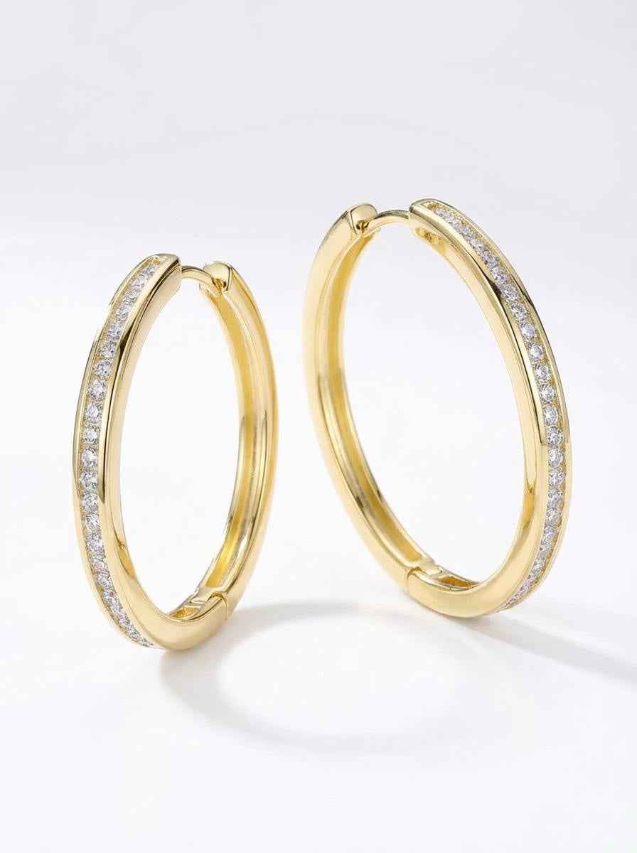 Gold-plated hoop earrings with clear moissanite stones, polished finish