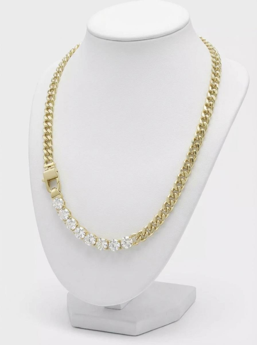 Gold-plated curb link necklace with row of clear cubic zirconia stones on display bust