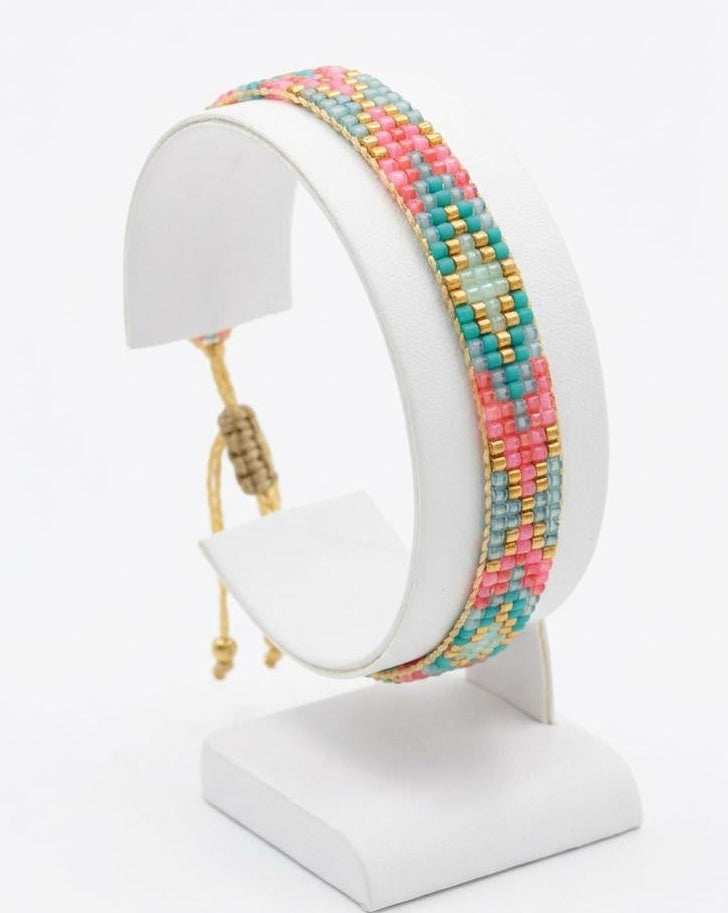 Colourful Miyuki bead bracelet with boho-inspired geometric design and tassel detail
