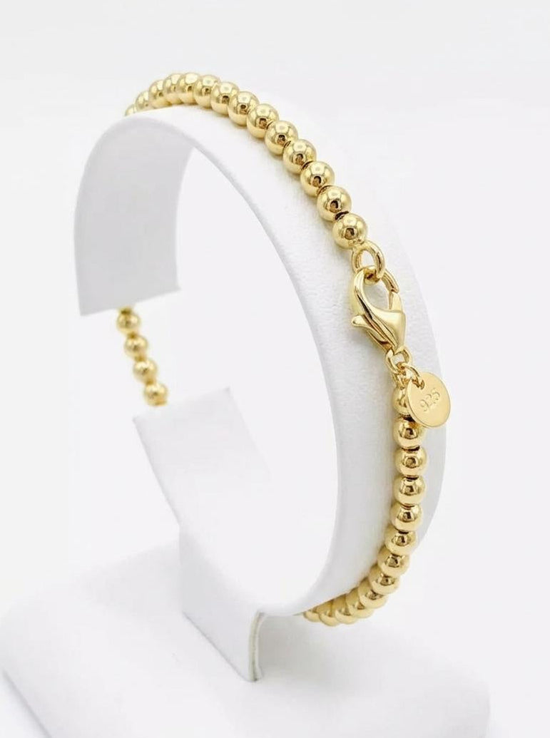18K gold plated 925 sterling silver beaded chain bracelet on display stand