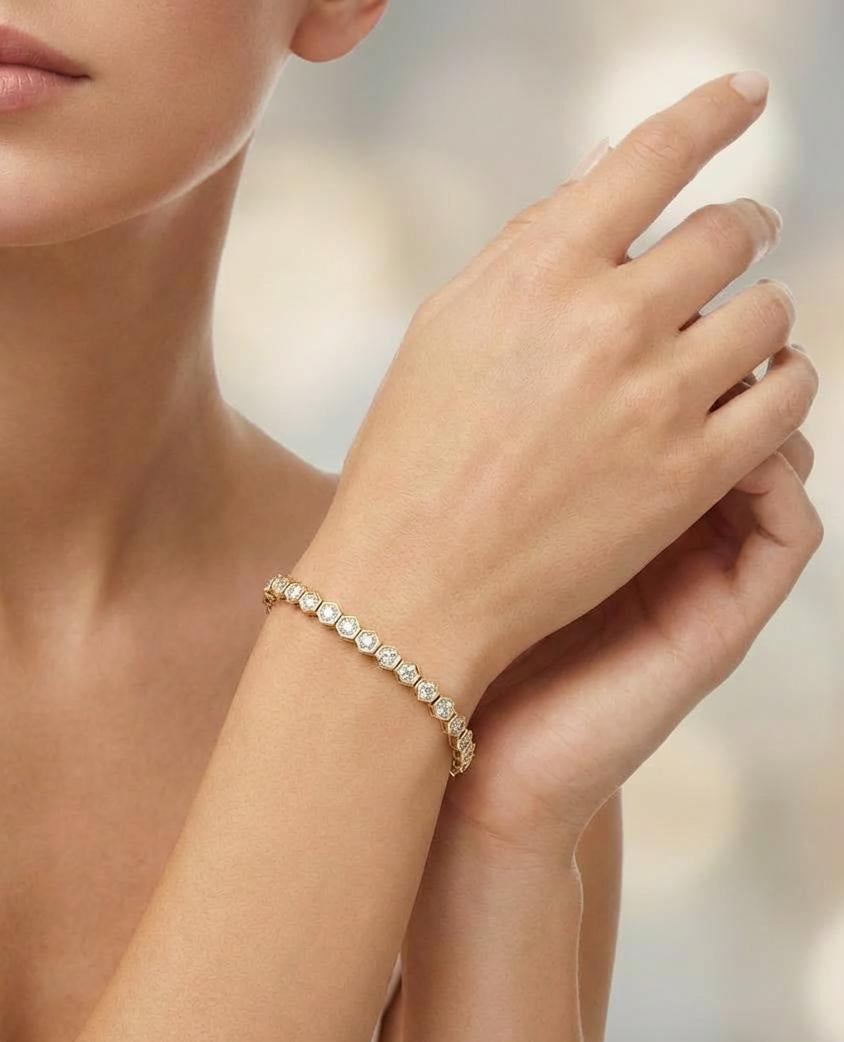 Gold plated rope chain bracelet with cubic zirconia accents worn on wrist
