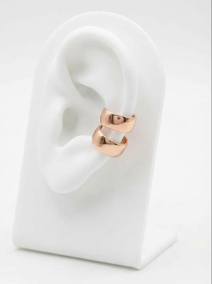 Close-up of rose gold-plated sterling silver ear cuff with polished finish