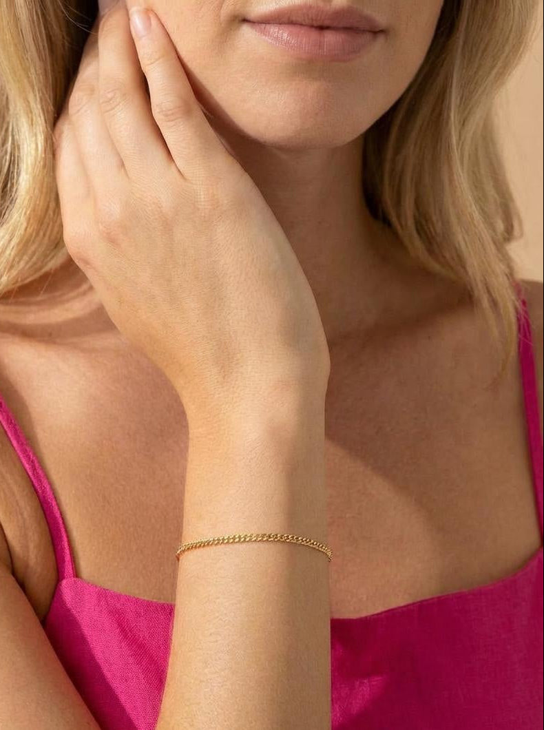 Minimalist gold curb chain bracelet, one on wrist