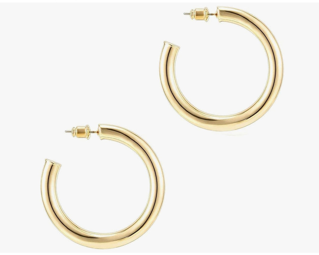Classic hoop earrings showing thickness and curved profile