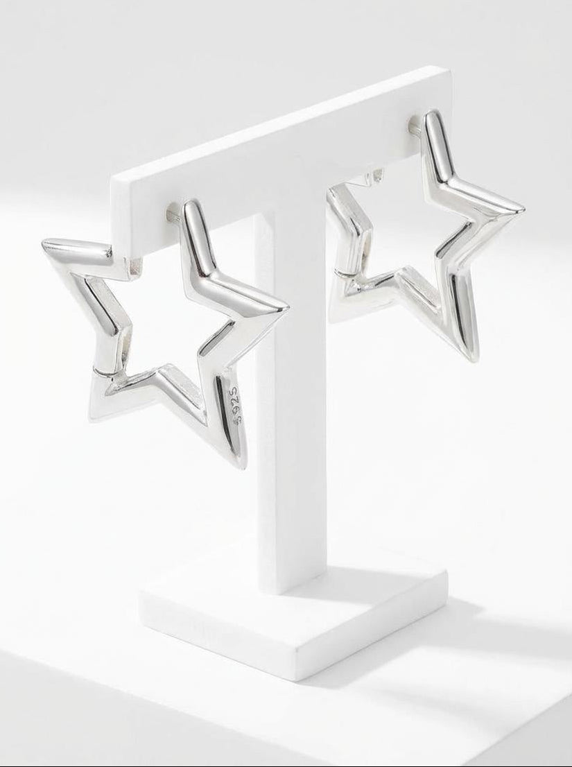 14K white gold plated hoop earrings displayed on minimalist jewelry stand