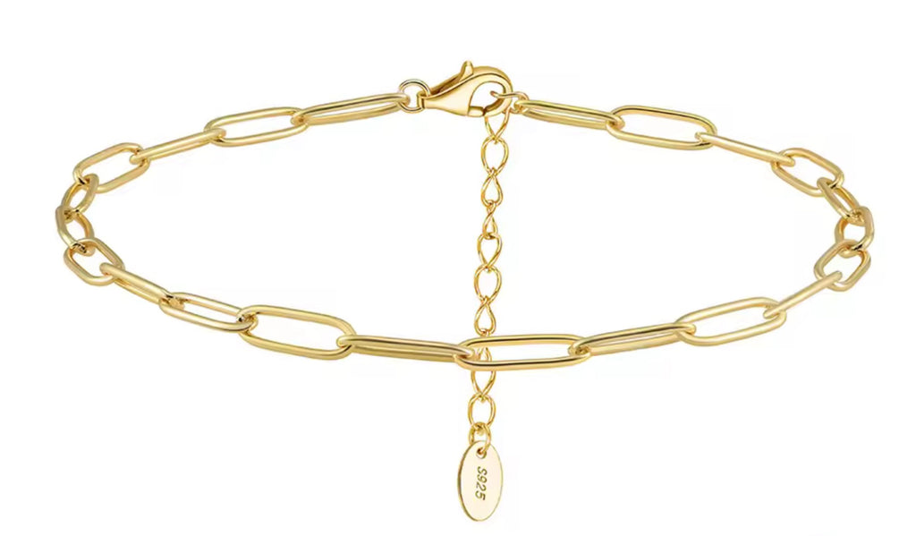Gold chain bracelet with a clasp on a white background