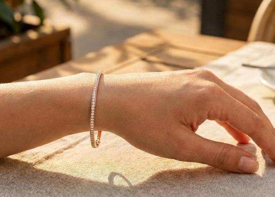 Hand wearing a rose Gold tennis bangle bracelet