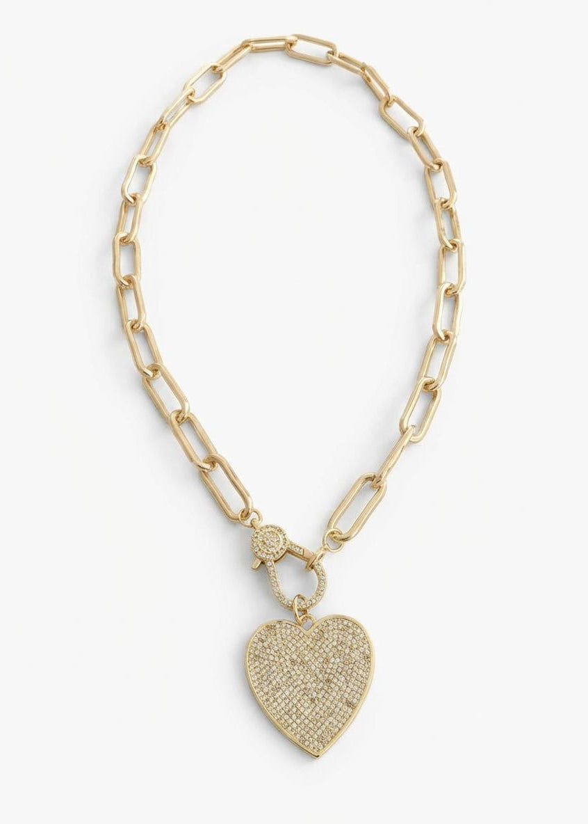 Gold chain necklace with a heart-shaped pendant on a white background