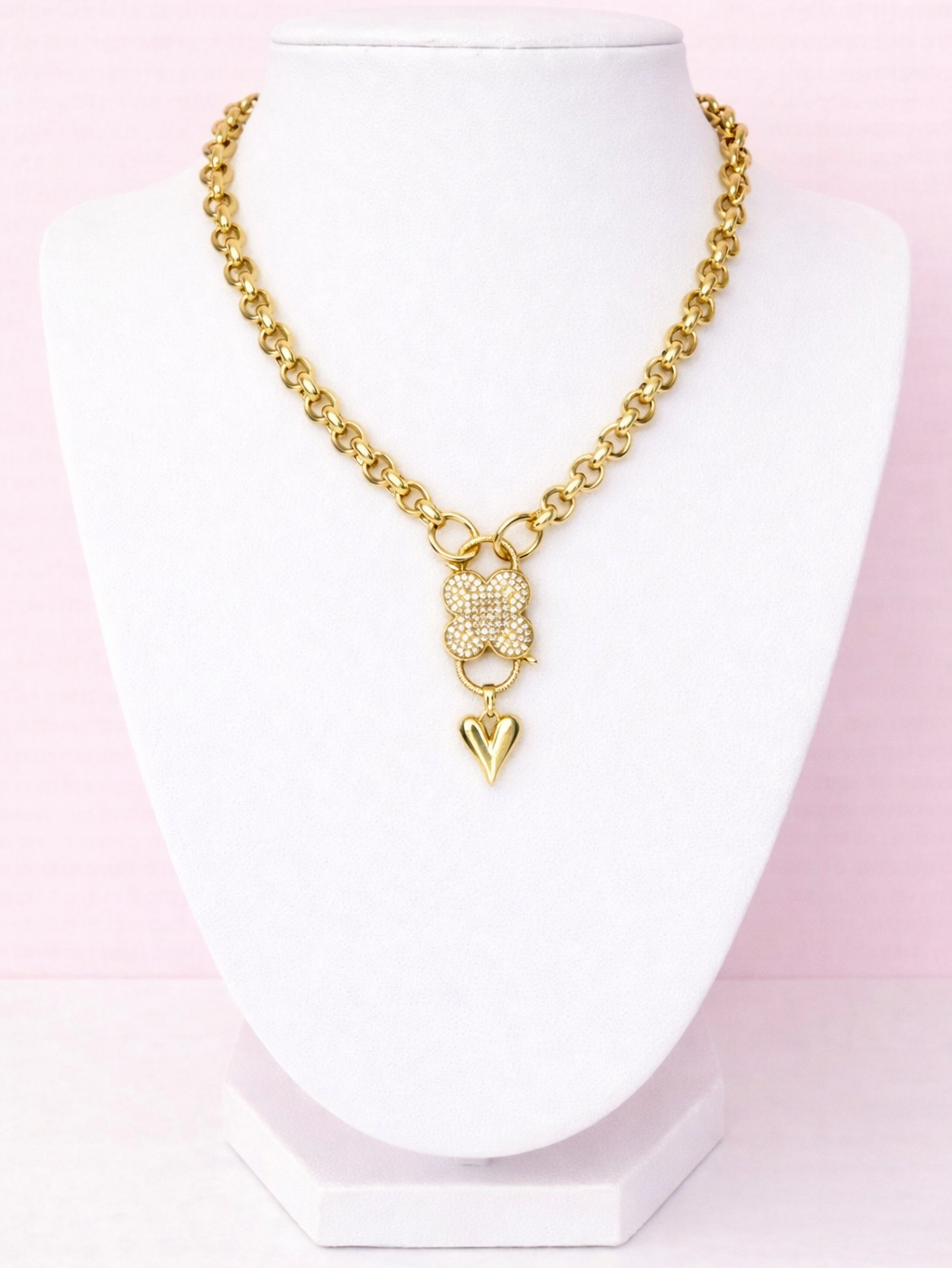 Gold clover charm necklace with cubic zirconia stones on stainless steel chain
