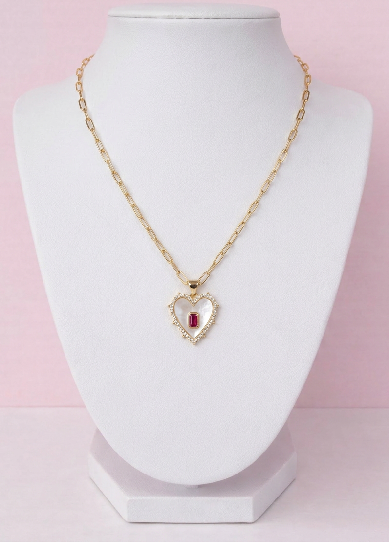 gold heart charm pendant necklace on display bust, cubic zirconia halo design, romantic jewellery piece