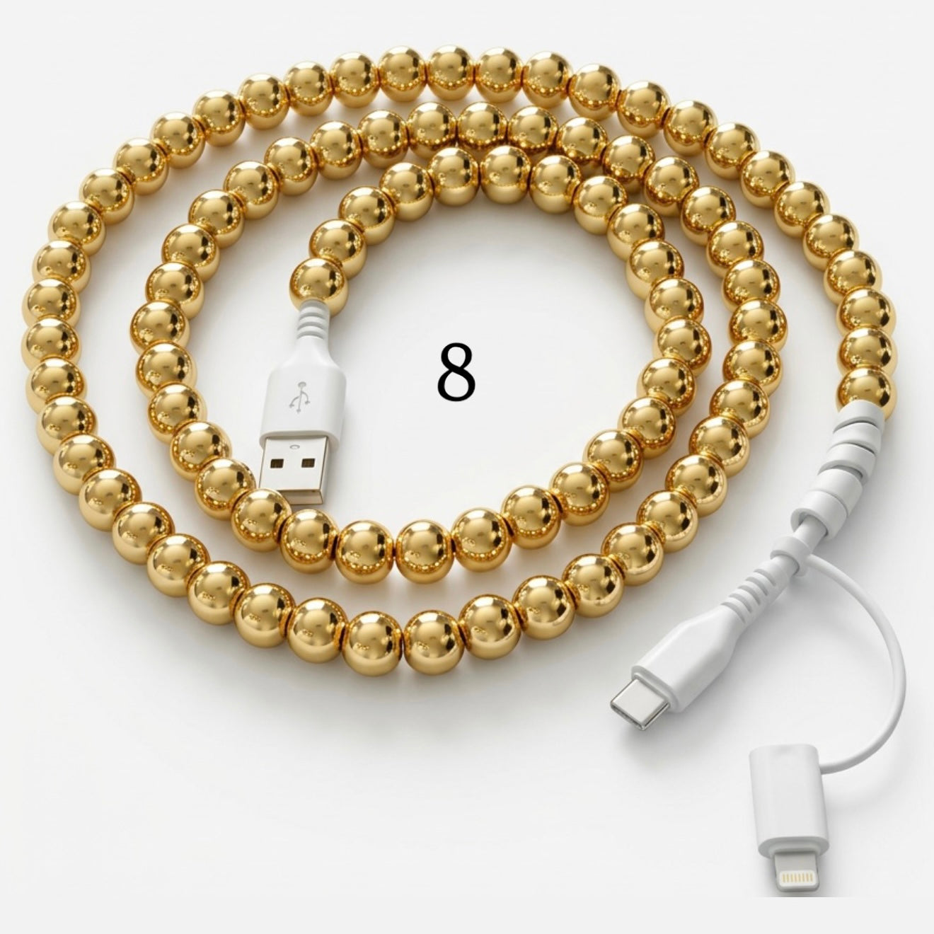 Gold beaded charging cable with USB connector and 2-in-1 Type-C and Lightning ends on white background