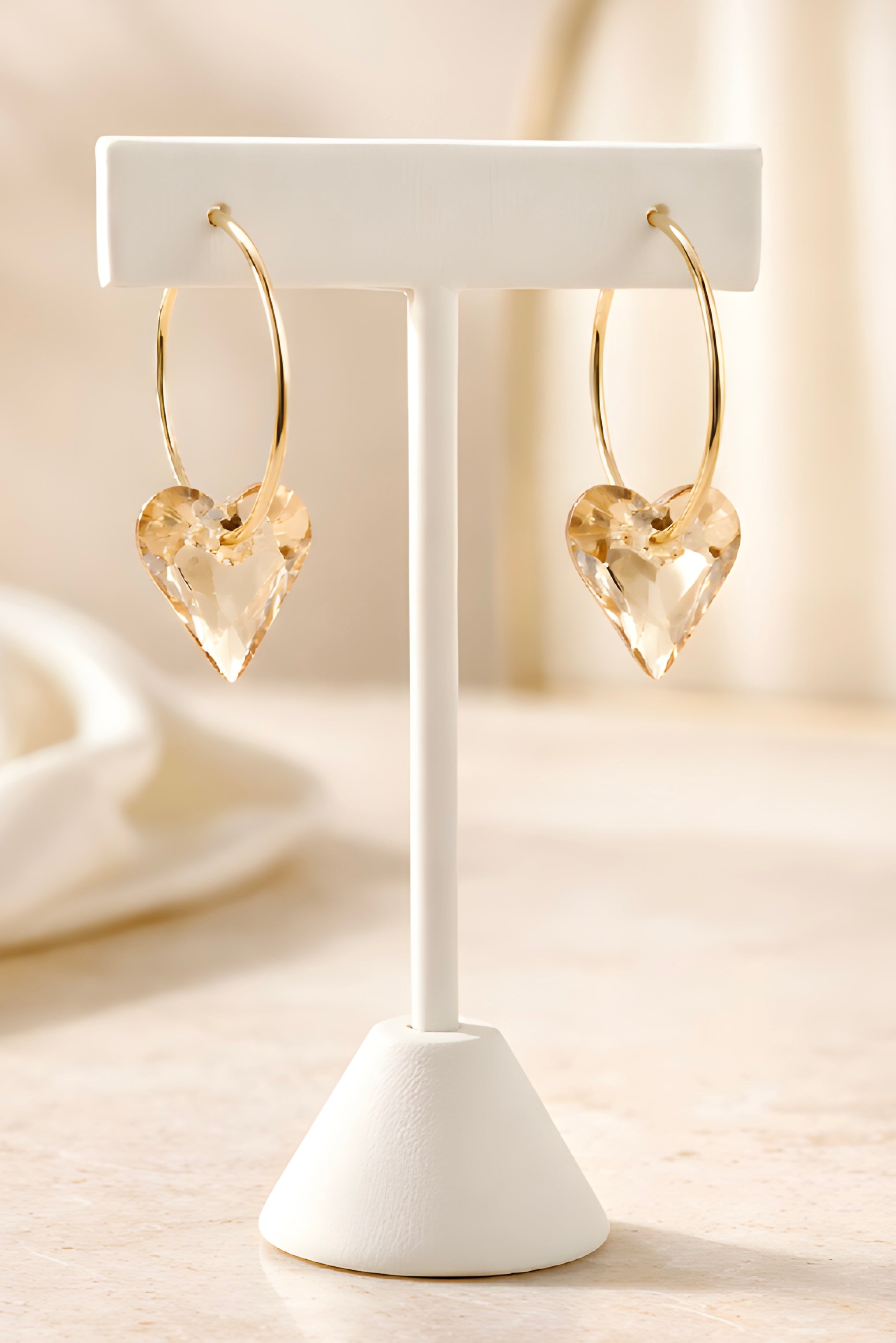Gold plated hoop earrings with removable heart charm jewelry display