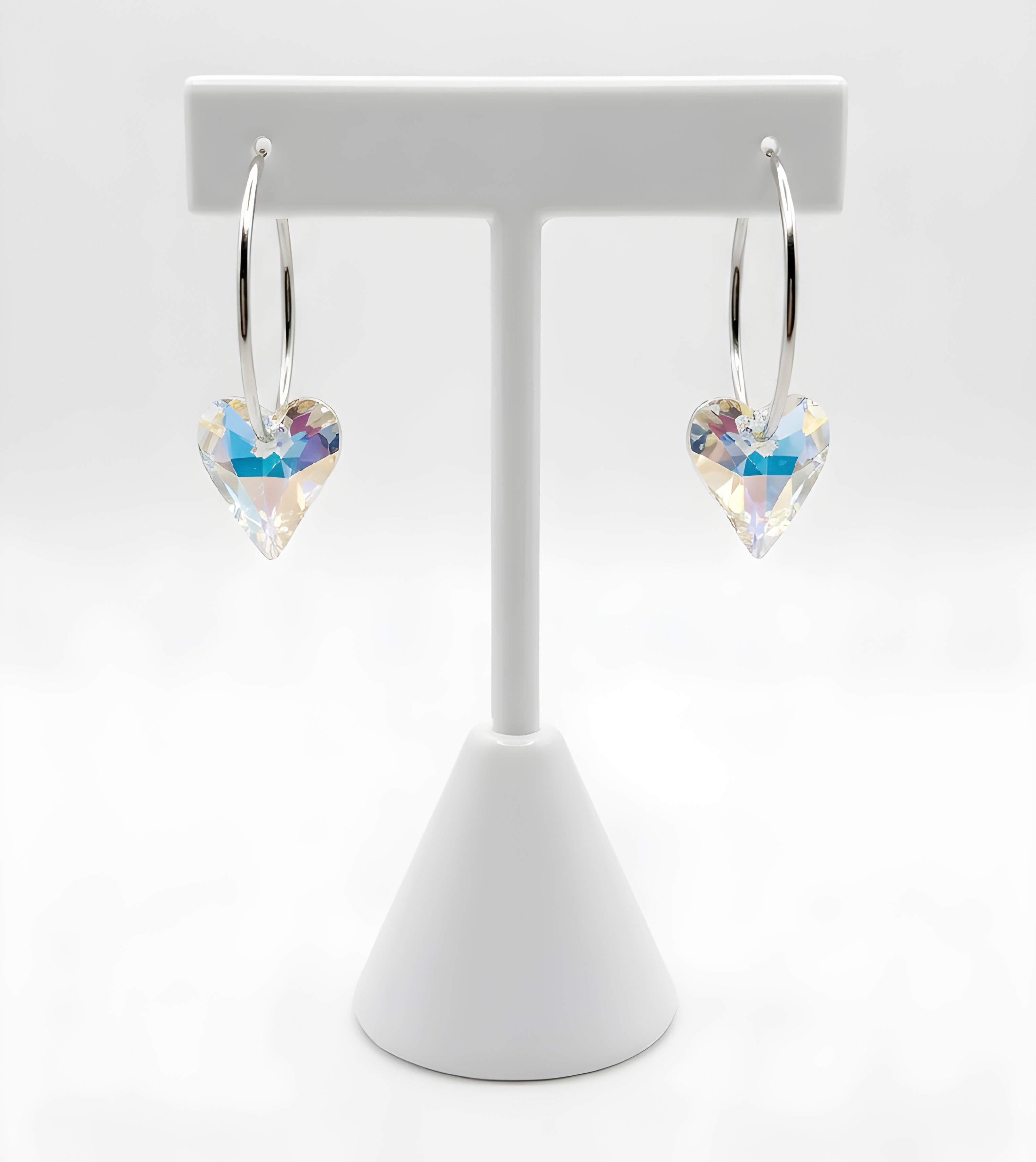 Silver hoop earrings with blue aurora crystal heart charm