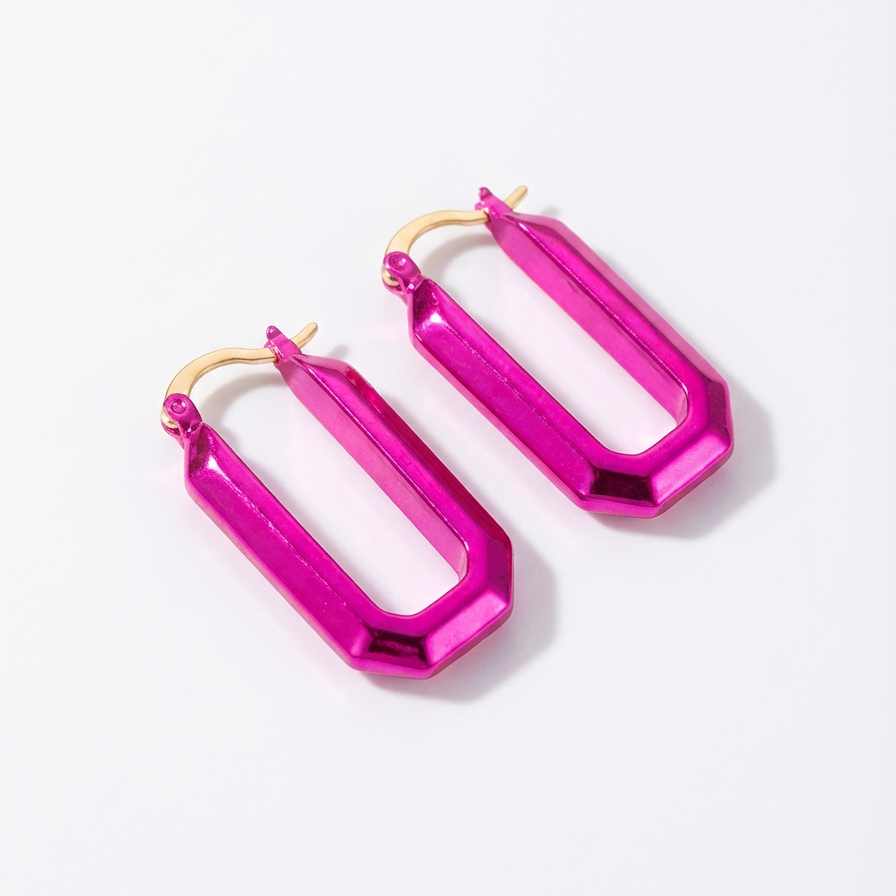Pair of bright pink hoop earrings on a white background